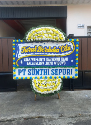 Papan Bunga Duka di Simpang